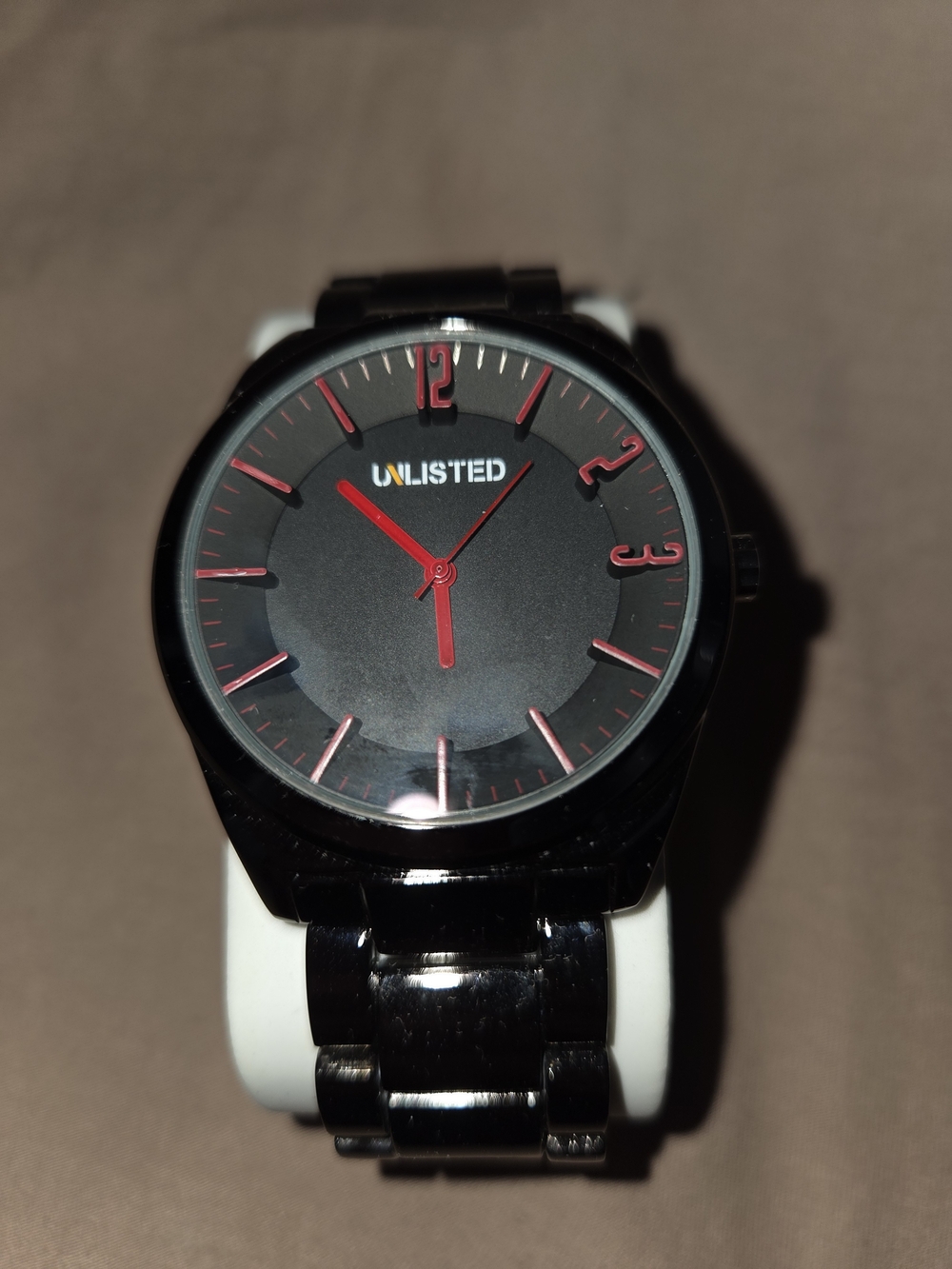 Unlisted Black Metal Watch with Red Accents